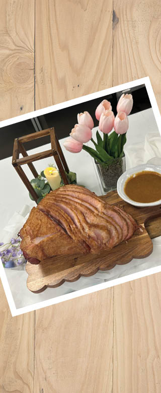Image of sliced sliced Holiday Ham on a table.