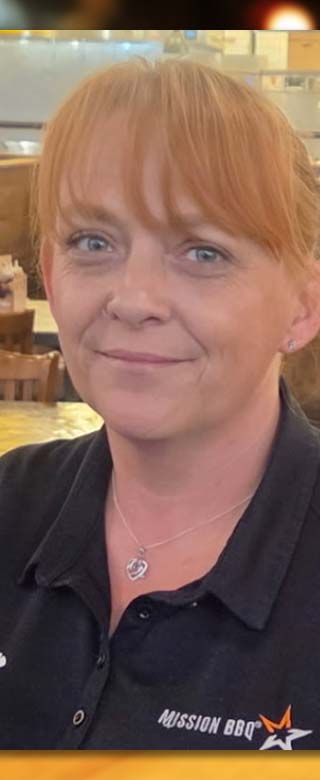 Image of a women with a MISSION BBQ Uniform on.